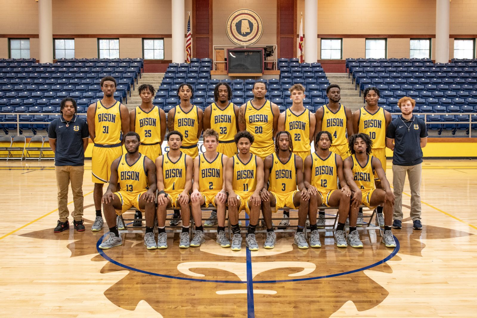 the suscc basketball team poses for a team photo