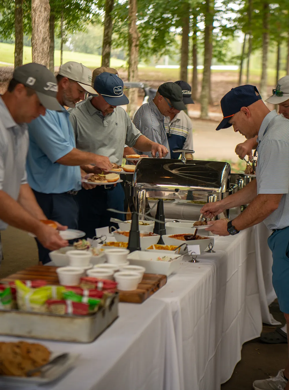 Catered lunch being served to gentlemen